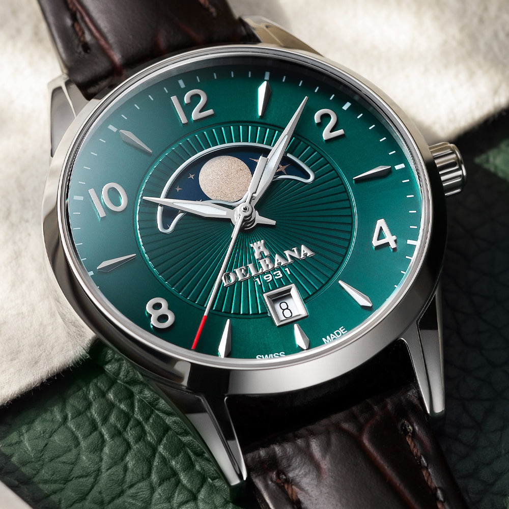 Delbana Lunetta stainless steel moonphase watch with deep teal dial and brown leather strap in context close up